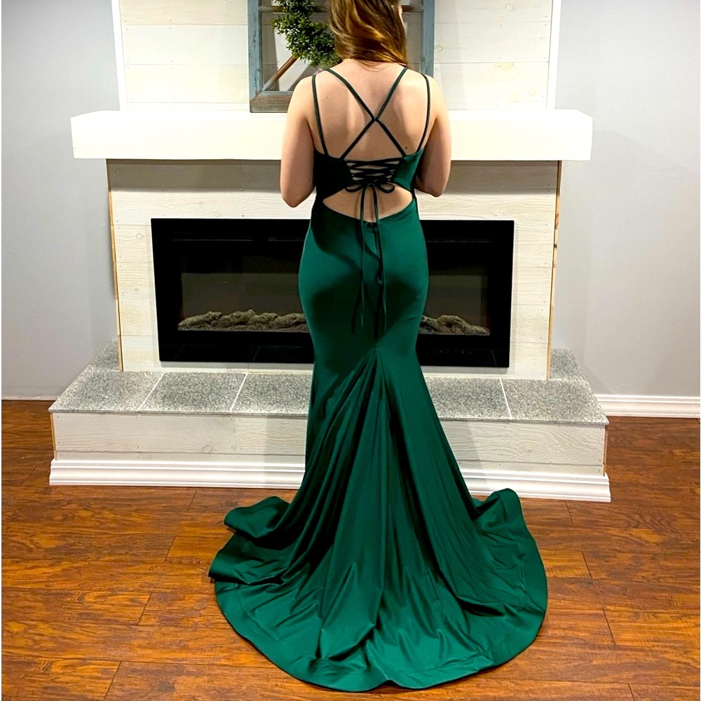 Selling emerald green prom dress. Worn once. Fitted to size 4.